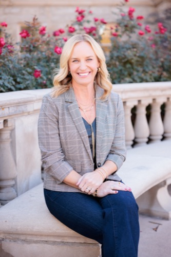 Tisha Taylor seated on a stone bench in Golden, Colorado